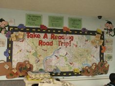 there is a large map on the wall in this school room that says take a reading road trip