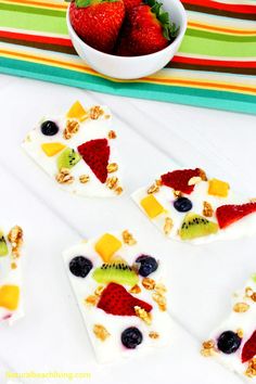 fruit and yogurt treats are arranged in the shape of fish