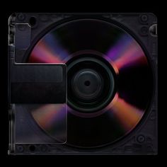 a close up of a cd on a black background with space for text or image