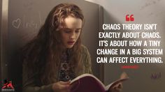 a young woman reading a book in front of a wall with writing on it and the caption chaos theory isn't exactly about chaos, it's about chaos