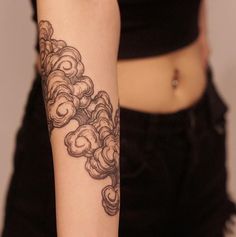 a woman with a tattoo on her arm