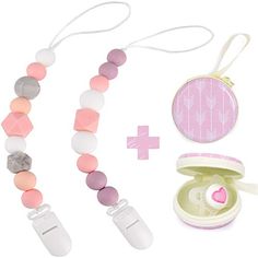 the contents of a necklace and earring set are shown in pink, white, and grey