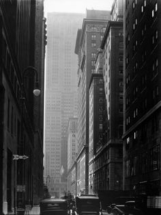 an old black and white photo of a city street