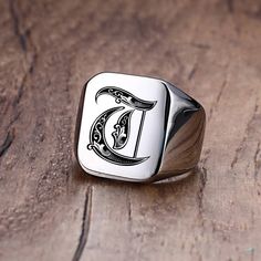 This Custom Old English Initial Signet Ring is a timeless piece of jewelry designed to add personalisation to any look. The classic Old English font brings a classic yet modern touch to any occasion. Customize this ring with your initial letter of choice for a unique, one-of-a-kind look.   SPECIFICATIONS   Surface Width: 18MM  Style: Vintage  Shapepattern: Letter  Metals Type: Stainless Steel  Material: High quality Stainless Steel  Material: Metal  Item Type: Rings  Environmental Standard: Lead Signet Ring For Men, Old English Font, Mens Stainless Steel Rings, Letter Ring, Wolfram, Initial Ring, Ring For Men, Old English, Stainless Steel Rings