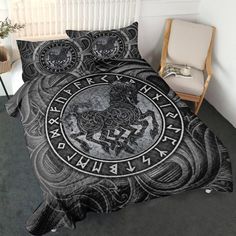 a bed with a black and white design on it