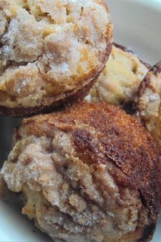 three muffins sitting on top of a white plate