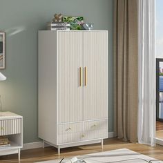 a white cabinet sitting in a living room next to a window