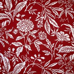 a red and white fabric with flowers on it