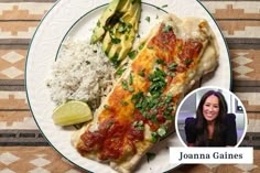 a white plate topped with fish and rice next to a slice of avocado