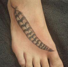 a foot with a black and white design on it