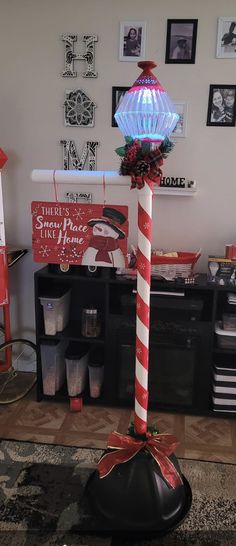 a candy cane is sitting in the middle of a room