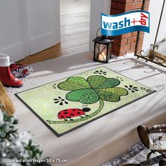 a st patrick's day door mat with a ladybug and shamrock on it