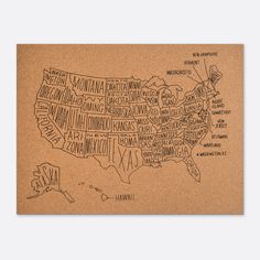 a cork board with the map of the united states on it, and words written in different languages