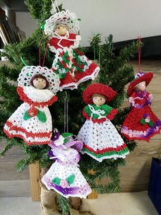 crocheted christmas ornaments hanging from a tree