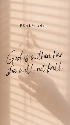 a hand holding a flower with the words god is within her she will not fall