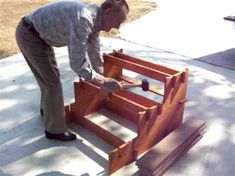 a man is working on some wooden steps