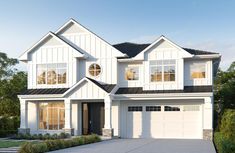 a white two story house with black roof