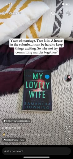 a book sitting on top of a bed next to pillows and pillow covers with text reading my lovely wife