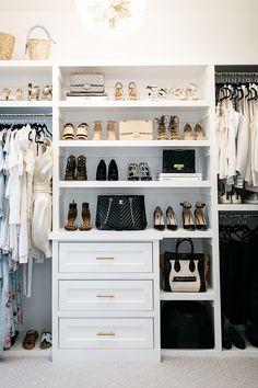 an organized closet with shoes, handbags and purses on the shelves in front of it