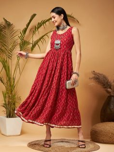 Embrace elegance with our Maroon Embroidered Sleeveless Tiered Dress. Made from Georgette fabric with polyester lining, it offers a fit & flare silhouette, a flared hemline, and features embroidery at the front bodice, adding a delicate and sophisticated touch to your ensemble. Tiered Dress, Bodice