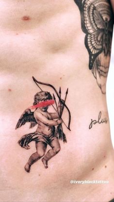 a tattoo on the side of a woman's stomach with an arrow and cupid