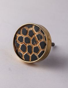 a giraffe print ring on a white surface