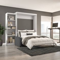 a bedroom with gray walls and white furniture