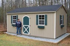 a man standing in front of a storage shed