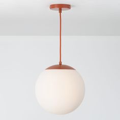 a white and brown light hanging from a ceiling