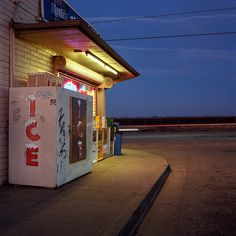 a vending machine sitting on the side of a building