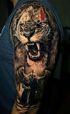 a man with a tattoo on his arm has an image of a tiger and a demon