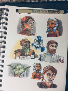 a notebook with some drawings of star wars characters on it