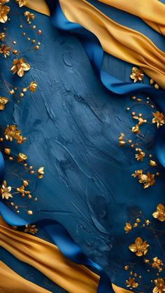 an abstract painting with gold flowers on blue and yellow fabric, in the shape of a square