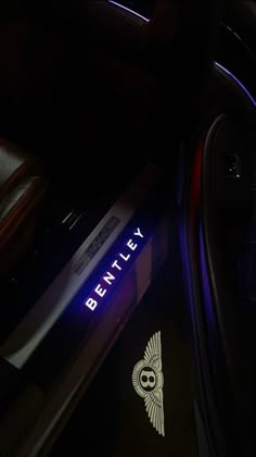 the interior of a car is lit up with blue and white lights that read bentley