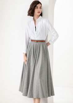 White A-line Skirt For Fall, White Flared Maxi Skirt For Fall, Classic Relaxed Fit Lined Maxi Skirt, White Full Skirt For Fall, White Flared Skirt For Winter, White Lined Maxi Skirt For Fall, Classic Gathered Maxi Skirt, Classic Midi Skirt With Pockets, White Flowy Skirt For Winter