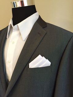 a suit with a white shirt and black tie