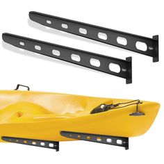 two yellow kayaks sitting next to each other on top of a white surface with holes in it