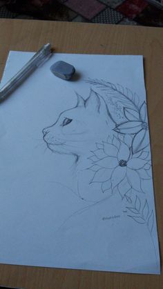 a pencil drawing of a cat with flowers on it