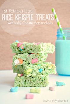 rice krispie treats stacked on top of each other with marshmallows in the background