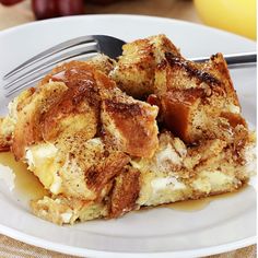 a white plate topped with french toast and syrup