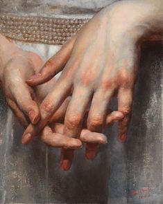 two hands holding each other in front of a painting