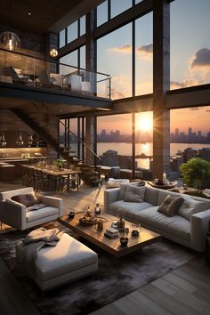 a living room filled with lots of furniture and windows overlooking the cityscape at sunset