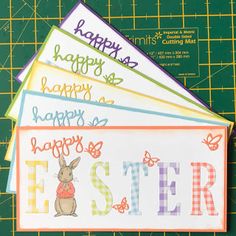 four easter cards on a cutting board