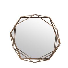 a mirror that is sitting on top of a white wall with a geometric design in the middle