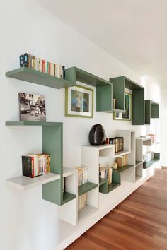 the bookshelves are lined up against the wall