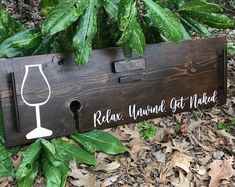 a wooden sign with a wine glass on it