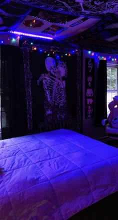 there is a bed with purple lights in the room