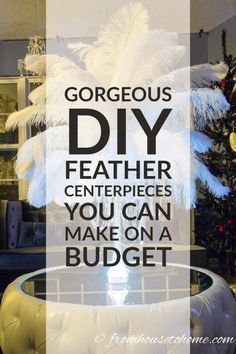 a white feather centerpiece with the words gorgeous diy on it in front of a christmas tree