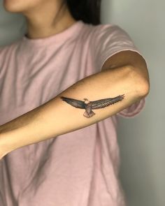 a woman with a tattoo on her arm