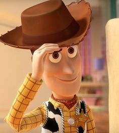 a cartoon character wearing a cowboy hat and holding his hand to his face while standing next to a pillar